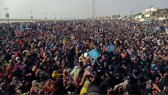 Supporters of the Balochistan Yakjehti Committee (BYC) listen to the speech of their leader during what they call the Baloch National Gathering in Gwadar, Pakistan, July 28, 2024. Reuters