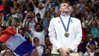 France's Leon Marchand during the medal ceremony in the men's 200m breaststroke event at the Paris Olympics. Reuters