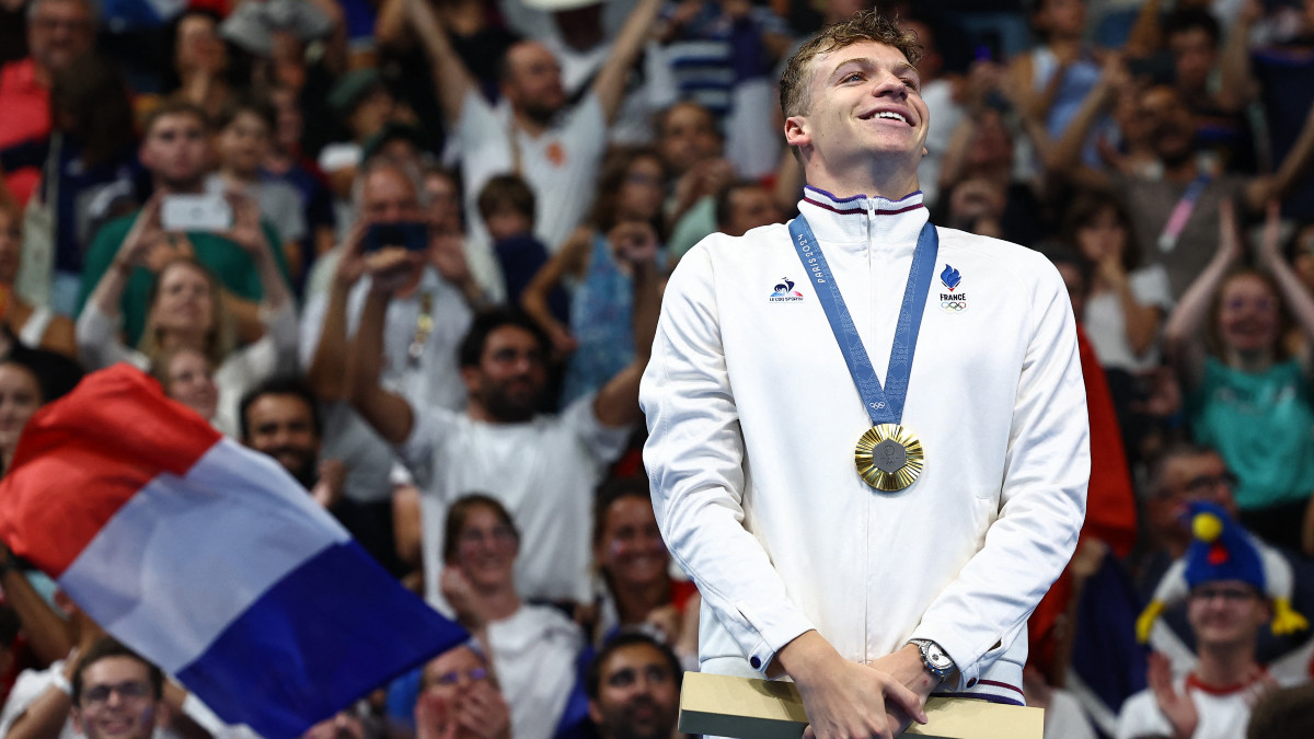 France's Leon Marchand during the medal ceremony in the men's 200m breaststroke event at the Paris Olympics. Reuters France's Leon Marchand during the medal ceremony in the men's 200m breaststroke event at the Paris Olympics. Reuters
