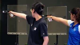 Manu Bhaker (in blue) during the Women's 25m Pistol final at the 2024 Paris Olympics. AP