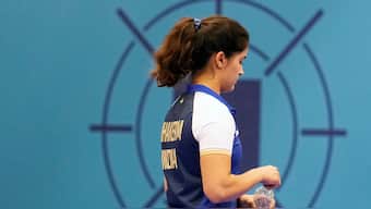 India's Manu Bhaker walks off after getting eliminated from the women's 25m pistol final at the Paris Olympics, finishing fourth in the event. AP