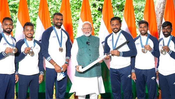  Indian hockey team presents PM Narendra Modi with signed stick in meet with Olympians