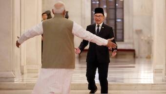 Prime Minister Narendra Modi, left, welcomes his Malaysian counterpart Anwar Ibrahim upon his arrival at the Indian presidential palace during his ceremonial reception in New Delhi, on August 20, 2024. AP
