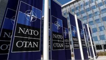 Banners displaying the NATO logo are placed at the entrance of new NATO headquarters during the move to the new building, in Brussels, Belgium April 19, 2018. REUTERS