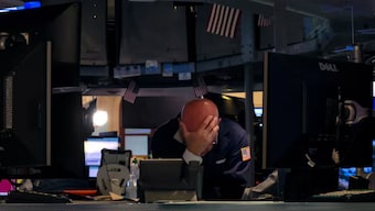 A specialist traders works at his post on the floor at the New York Stock Exchange (NYSE) in New York City, US, June 12, 2024. File Image/Reuters