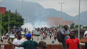 Police fire tear gas during a protest in Abuja, Nigeria, on Thursday. AP