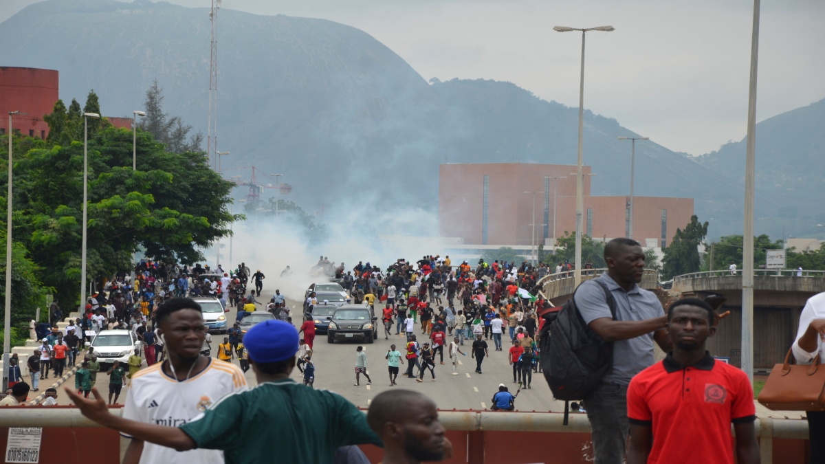 Police fire tear gas during a protest in Abuja, Nigeria, on Thursday. AP Police fire tear gas during a protest in Abuja, Nigeria, on Thursday. AP