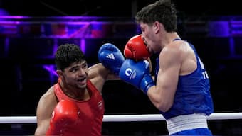 India's Nishant Dev lands a jab on Mexico's Marco Verde during the men's welterweight quarter-finals in the Paris Olympics. AP