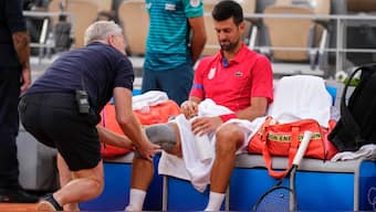 Novak Djokovic needed medical attention for his knee during the win against Stefanos Tsitsipas at the Paris Olympics. AP