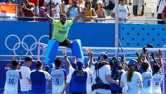 India goalkeeper PR Sreejesh, who had already declared the Paris Olympics to be his international swansong, sits on top of the goalpost following his team's 2-1 victory over Spain in the bronze medal playoff match. AP