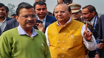 Delhi Chief Minister Arvind Kejriwal with Lt Governor VK Saxena attends the flag off ceremony of 350 electric buses, in New Delhi. PTI