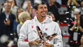 Alexei Popyrin holds the winner's trophy after defeating Andrey Rublev in the final of the National Bank Open men's tennis tournament in Montreal. AP