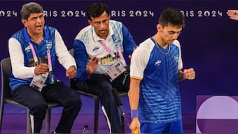 Lakshya Sen get cheered on by coaches Vimal Kumar and Prakash Padukone during the Paris Olympics. PTI
