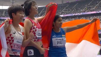Preethi Pal (R) celebrates after winning bronze in 100m T35 race at 2024 Paris Paralympics.