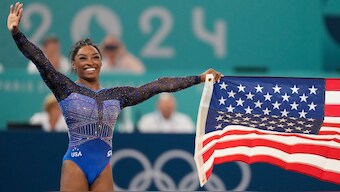 USA's Simone Biles celebrates after winning gymnastics all-round gold in the Paris Olympics on Thursday, 1 August. AP
