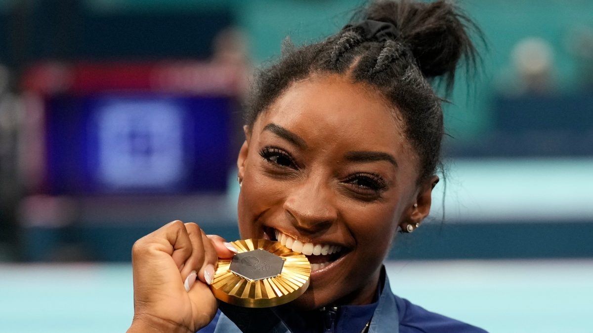 Simone Biles celebrates after winning gold at the women's artistic gymnastics all-around final at the Paris Olympics. AP Simone Biles celebrates after winning gold at the women's artistic gymnastics all-around final at the Paris Olympics. AP