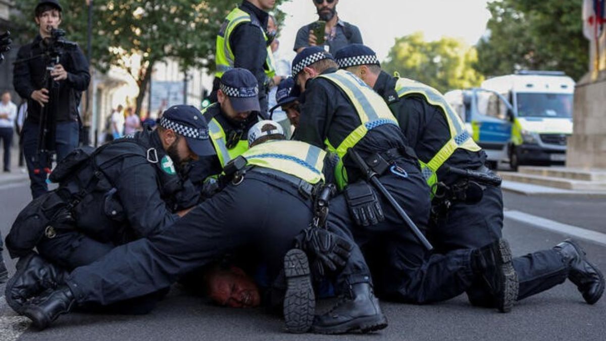Police officers detain a demonstrator during a protest against illegal immigration outside of Downing Street in London, UK, July 31, 2024. Reuters Police officers detain a demonstrator during a protest against illegal immigration outside of Downing Street in London, UK, July 31, 2024. Reuters