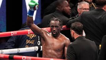 Terence Crawford raises his fist at the end of a 12-round fight against Israil Madrimov during their super welterweight championship boxing match in Los Angeles. AP