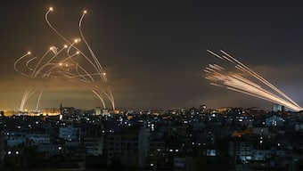 The Israeli Iron Dome missile defence system (left) intercepts rockets fired from Gaza Strip. (Representative Photo, Credit: Anas Baba/AFP)