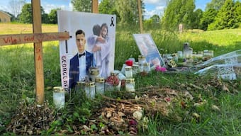 Flowers and other objects are placed at a memorial site for young men shot dead in the suburb of Varberga in May, in Orebro, Sweden, June 22, 2022. REUTERS