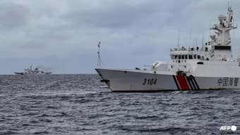 China Coast Guard ships are seen from the Philippine Coast Guard vessel BRP Cabra during a supply mission to Sabina Shoal in disputed waters of the South China Sea on Aug 26, 2024. (Photo: AFP/Jam Sta Rosa)