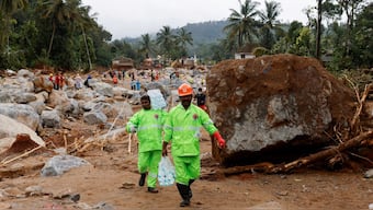 Volunteers carry water bottles to distribute to rescue teams, after several landslides hit the hills in Wayanad district, in the southern state of Kerala, July 31, 2024. Reuters