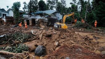 (File) Rescuers search through mud and debris for a third day after landslides set off by torrential rains in Wayanad district, Kerala, on August 1, 2024. AP