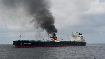 Smoke rises from a merchant vessel, after the vessel was struck by a Houthi anti-ship missile, at the location given as Gulf of Aden, in this handout picture released January 27, 2024. REUTERS/File Photo