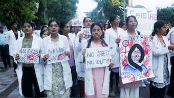 Doctors of KGMU Lucknow take part in a candle light march in protest against the rape and murder of a trainee doctor in Kolkata, in Lucknow,  August 12, 2024. PTI