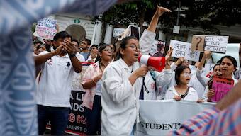 Doctors shout slogans as they hold placards during a protest rally demanding justice following the rape and murder of a trainee medic at a hospital in Kolkata, in New Delhi, August 18, 2024. File Photo-Reuters