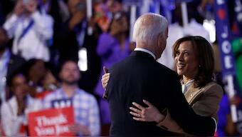 US Vice President and 2024 Democratic presidential candidate Kamala Harris (R) hugs US President Joe Biden after he spoke on the first day of the Democratic National Convention (DNC) at the United Center in Chicago, Illinois, on August 19, 2024. AFP