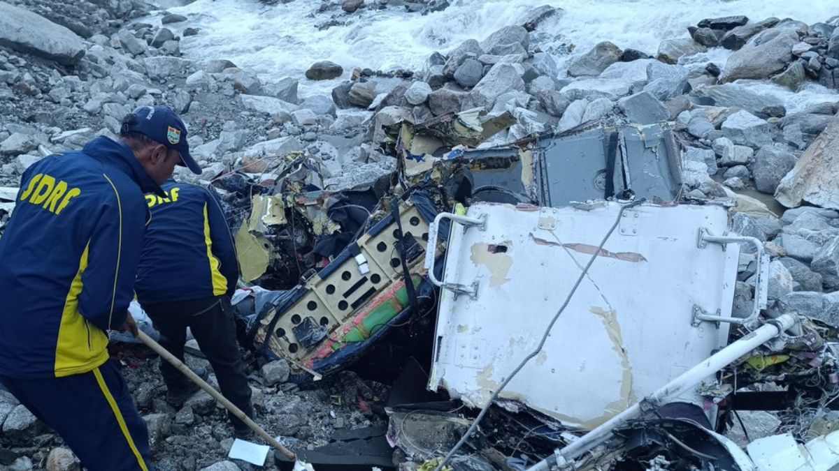 SDRF officials inspecting the crashed helicopter's debris. Source: X SDRF officials inspecting the crashed helicopter's debris. Source: X