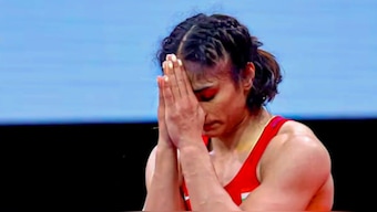 India's Vinesh Phogat reacts after winning her quarter-final bout against Ukraine's Oksana Livach during the women's wrestling 50kg event in the Paris Olympics. PTI