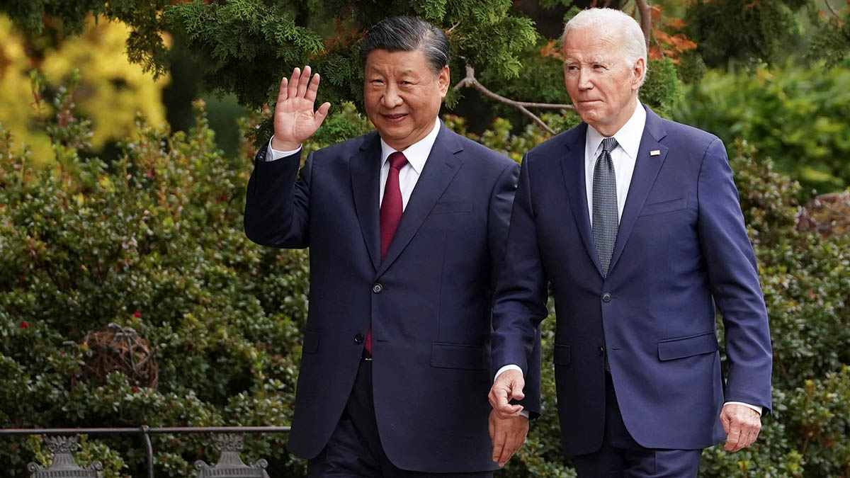 Chinese President Xi Jinping waves as he walks with US President Joe Biden. File image/ Reuters Chinese President Xi Jinping waves as he walks with US President Joe Biden. File image/ Reuters