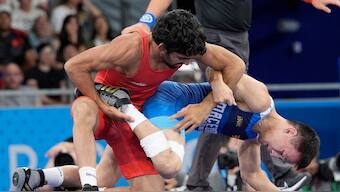 India's Aman defeated North Macedonia's Vladimir Egorov, right, compete in the round of 16 of the men's freestyle 57kg wrestling match. AP