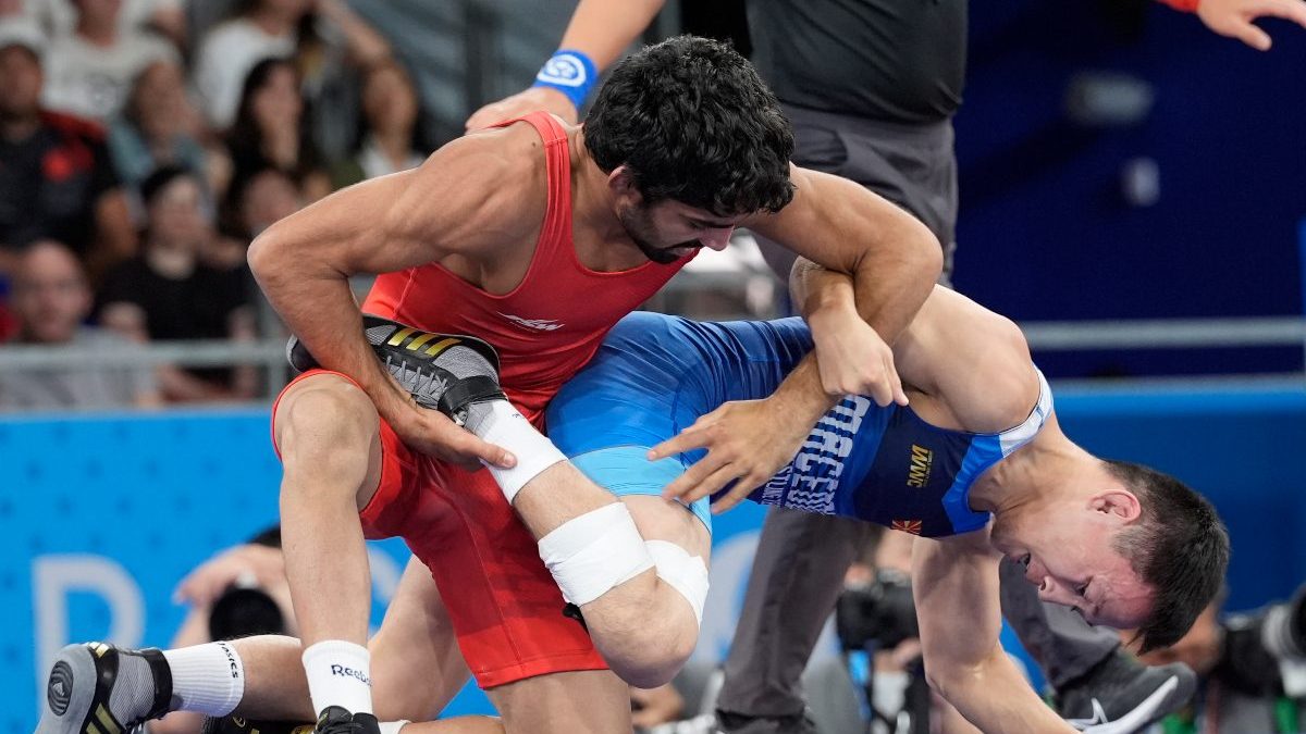 India's Aman defeated North Macedonia's Vladimir Egorov, right, compete in the round of 16 of the men's freestyle 57kg wrestling match. AP India's Aman defeated North Macedonia's Vladimir Egorov, right, compete in the round of 16 of the men's freestyle 57kg wrestling match. AP