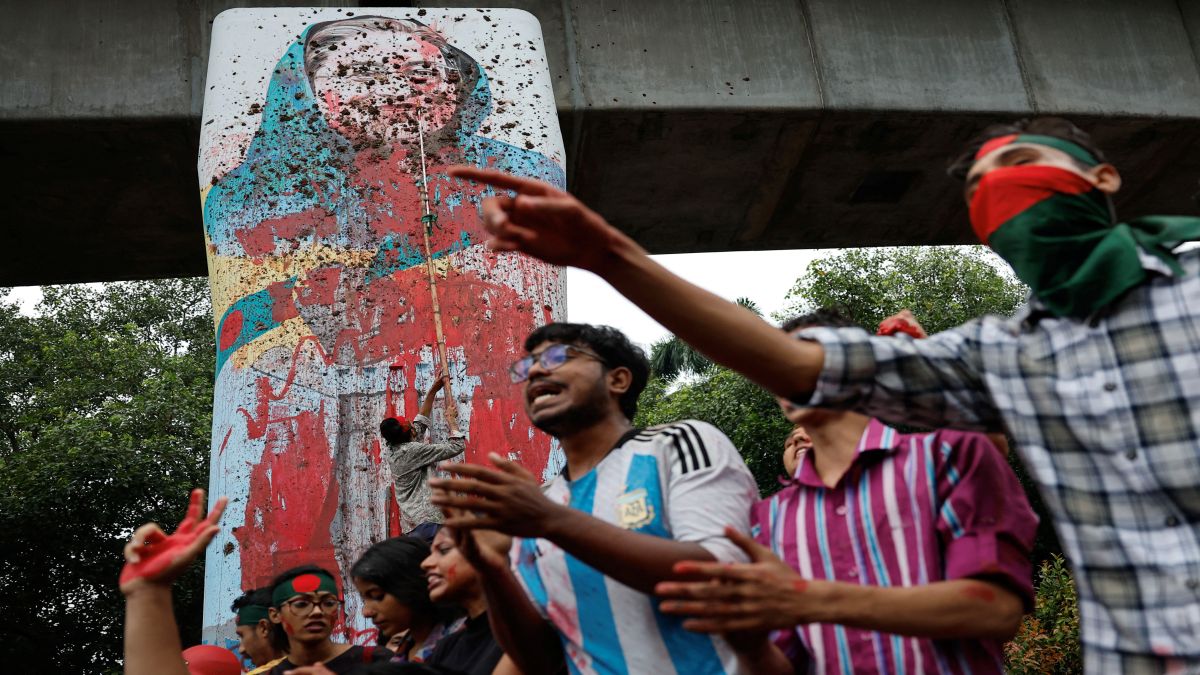 Protesters shout slogans as they vandalise a mural of now former Bangladeshi Prime Minister Sheikh Hasina with paint and mud at Teacher Student Centre (TSC) area of University of Dhaka in Dhaka, Bangladesh. Reuters Protesters shout slogans as they vandalise a mural of now former Bangladeshi Prime Minister Sheikh Hasina with paint and mud at Teacher Student Centre (TSC) area of University of Dhaka in Dhaka, Bangladesh. Reuters