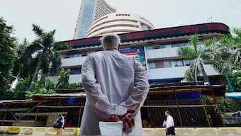 A man looks at the stock ticker on Dalal Street. The Sensex crashed 2,686.09 points, or 3.31 per cent to 78,295.86 during the afternoon trade. File image/PTI
