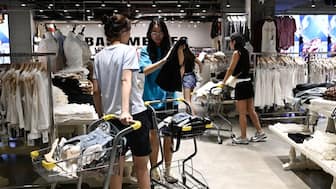 Women shop for clothes at a shopping mall in Beijing. Ozempic and Wegovy users are turning their weight loss into a reason for a shopping spree. Representational image/AFP