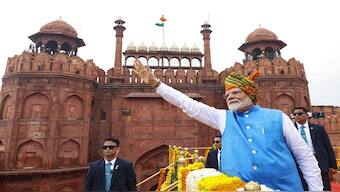 Prime Minister Narendra Modi greets the gathering at the Red Fort on 78th Independence Day, in New Delhi. PTI
