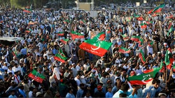 Supporters of jailed former Pakistani Prime Minister Imran Khan's party, the Pakistan Tehreek-e-Insaf (PTI), wave party flags during a rally in Islamabad, Pakistan. File image/ Reuters