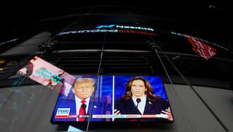 A screen shows the presidential debate between Republican presidential nominee and former US President Donald Trump and Democratic presidential nominee and US Vice President Kamala Harris outside the Nasdaq MarketSite in New York City, US. Reuters