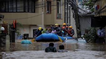 Security force members use an inflatable raft to bring residents to safety from a flooded area near the bank of the overflowing Bagmati River following heavy rains, in Kathmandu, Nepal September 28, 2024. Reuters