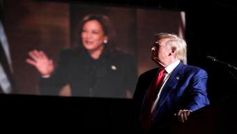 Republican presidential nominee former President Donald Trump speaks as an image of democratic presidential candidate Vice President Kamala Harris appears on screen during a campaign event at the World Market Centre, Friday, September 13, 2024, in Las Vegas. File Image: AP