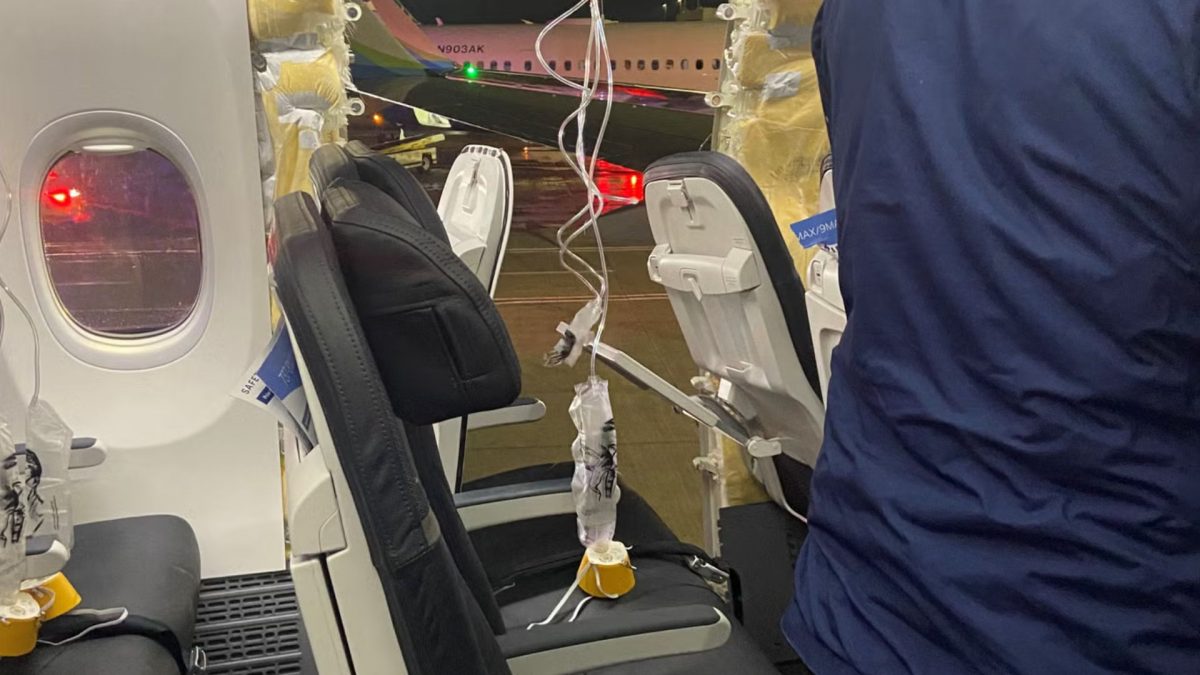 Passenger oxygen masks hang from the roof next to a missing window and a portion of a side wall of an Alaska Airlines Flight 128. Source: REUTERS. Passenger oxygen masks hang from the roof next to a missing window and a portion of a side wall of an Alaska Airlines Flight 128. Source: REUTERS.