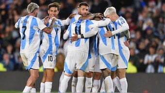 Argentina celebrate with Julian Alvarez after he scored his side's second goal against Chile in a FIFA World Cup Qualifier. AP