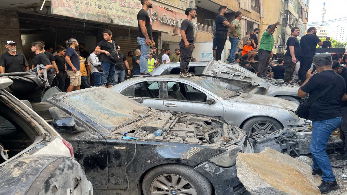 People gather at the scene of an Israeli missile strike in the southern suburbs of Beirut, on Friday. AP People gather at the scene of an Israeli missile strike in the southern suburbs of Beirut, on Friday. AP