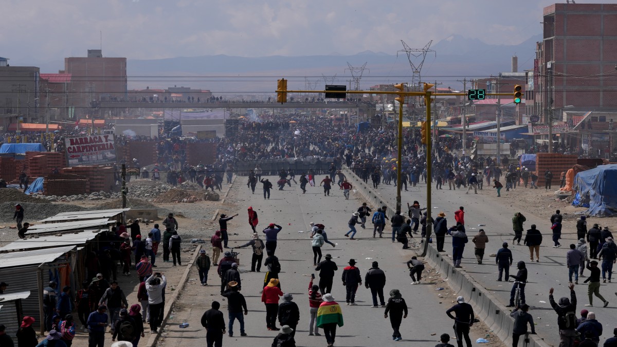 Supporters of former President Evo Morales, below, face off with supporters current President Luis Arce in El Alto, Bolivia. AP Supporters of former President Evo Morales, below, face off with supporters current President Luis Arce in El Alto, Bolivia. AP