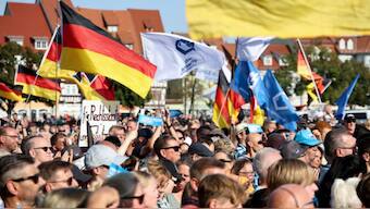 People gather at an election campaign rally of Alternative for Germany (AfD) party ahead of the Thuringia state elections, in Erfurt, Germany August 31, 2024. Photo- Reuters