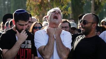 Yigal Sarusi, center, mourns during the funeral of his son, slain hostage Almog Sarusi, who was killed in Hamas captivity in the Gaza Strip, at a cemetery in Ra'anana, Israel, Sunday, Sept. 1, 2024. Photo- AP